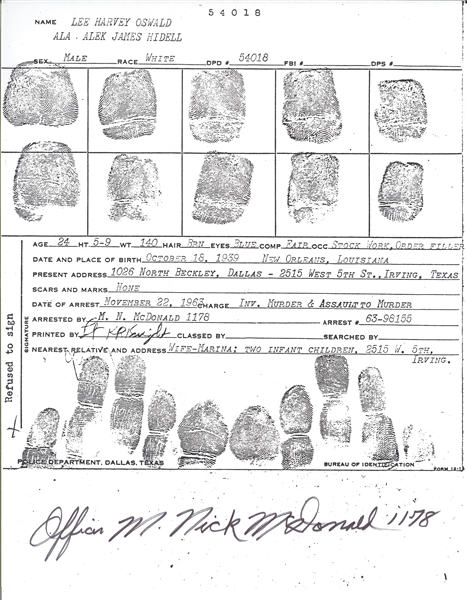 Officer M. Nick McDonald Autographed Lee Harvey Oswald Booking Sheet